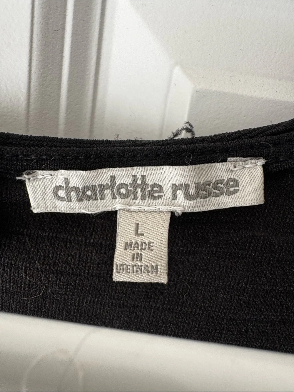 Charlotte Russe Black dress with White Asymmetrical Trim